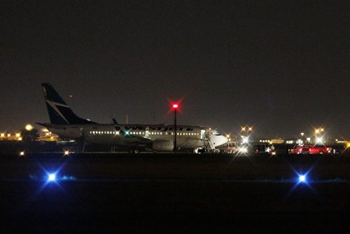 June 29, 2015 - 150629  -   Emergency crews were called to attend to a WestJet flight from Edmonton to Toronto which was diverted to Winnipeg due to a threat Monday, June 29, 2015.  John Woods / Winnipeg Free Press