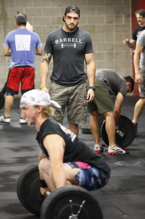 June 30, 2015 - 150630 - CrossFit coach Cole Nedohin looks over athletes at CrossFit 204 Tuesday, June 30, 2015.  John Woods / Winnipeg Free Press