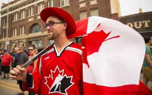 Christopher Allard celebrates Canada Day at the annual Osborne Street Festival on Wednesday, July 1, 2015. Mikaela MacKenzie / Winnipeg Free Press