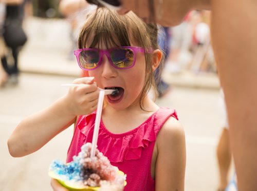 Eliot Chilton, 6, eats slush on Canada Day at the annual Osborne Street Festival on Wednesday, July 1, 2015. Mikaela MacKenzie / Winnipeg Free Press