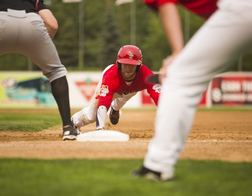 Brad Boyer of the Winnipeg Goldeyes dives back to second base while playing the Sioux City Explorers on Canada Day at Shaw Park on Wednesday, July 1, 2015. Mikaela MacKenzie / Winnipeg Free Press