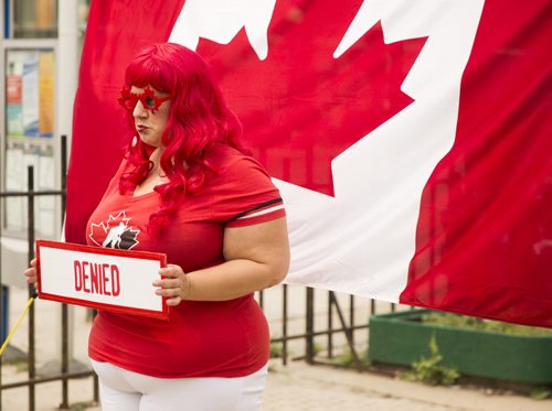 Sarah Fordham finds out that she would not have made it into Canada with the strict immigration laws after taking a quiz at the annual Osborne Street Festival on Wednesday, July 1, 2015. Mikaela MacKenzie / Winnipeg Free Press