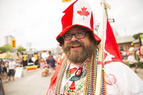 Mike Witty celebrates Canada Day in full costume at the annual Osborne Street Festival on Wednesday, July 1, 2015. Mikaela MacKenzie / Winnipeg Free Press