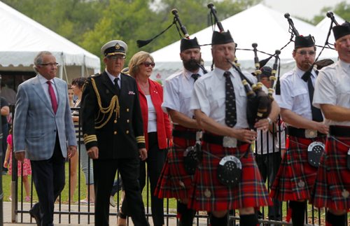 Canada Day party at the Assiniboine Park Lyric Theatre. The Honourable Janice C. Filmon gets piped into the event. Husband Gary Filmon with her. BORIS MINKEVICH/WINNIPEG FREE PRESS July 1, 2015