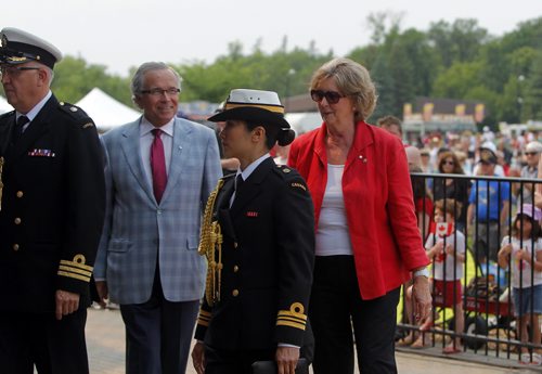 Canada Day party at the Assiniboine Park Lyric Theatre. The Honourable Janice C. Filmon gets piped into the event. Husband Gary Filmon with her. BORIS MINKEVICH/WINNIPEG FREE PRESS July 1, 2015