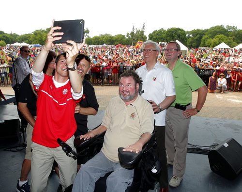 Canada Day party at the Assiniboine Park Lyric Theatre. Mayor Brian Bowman tries to set some sort of record for a super selfie with all sorts of VIP. BORIS MINKEVICH/WINNIPEG FREE PRESS July 1, 2015