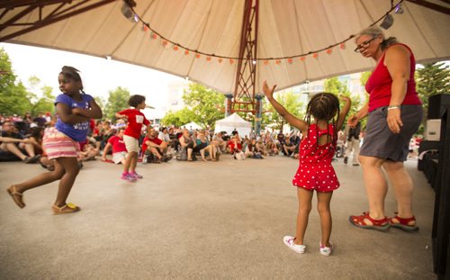Young and old dance to the live music on Canada Day at the Forks on Wednesday, July 1, 2015. Mikaela MacKenzie / Winnipeg Free Press