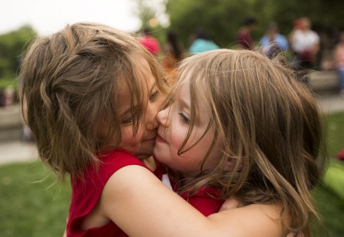 Makenzie Ross-Stewart (left) and Kiera McPherson, four-year-old cousins, celebrate Canada Day at the Forks on Wednesday, July 1, 2015. Mikaela MacKenzie / Winnipeg Free Press