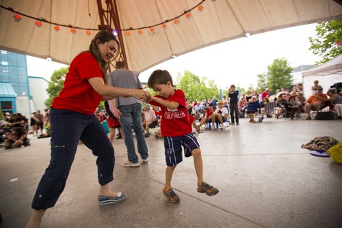 Martha Reyes and her son, Thomas Moreno, dance at the Canada Day festivities at the Forks on Wednesday, July 1, 2015. Mikaela MacKenzie / Winnipeg Free Press
