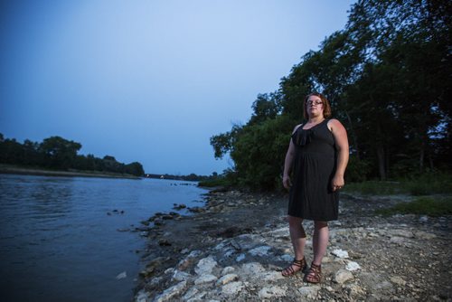 Danielle Hodson stands by the river where she found a chunk of human hair two days ago on Wednesday, July 1, 2015. Mikaela MacKenzie / Winnipeg Free Press