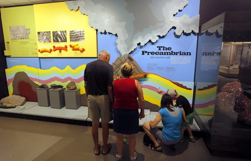 The Manitoba Museum. Some people look at the Precambrian exhibit that shows how the land was formed in Manitoba. BORIS MINKEVICH/WINNIPEG FREE PRESS July 1, 2015