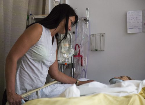 Carla Harder, Alyssa Selman's mom, comforts her daughter at the Health Sciences Centre on Thursday, July 2, 2015. Mikaela MacKenzie / Winnipeg Free Press