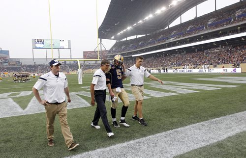 Winnipeg Blue Bombers' quarterback Drew Willy (5) was hurt while playing against the Hamilton Tiger-Cats'  during first half CFL action, Thursday, July 2, 2015. (TREVOR HAGAN/WINNIPEG FREE PRESS)