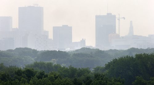 Another smoky haze hangs on the Winnipeg skyline Friday morning as seen from Westview Park. An air quality warning is in effect due to the smoke from forrest fires in Canada's northwest.     Weather story. Wayne Glowacki / Winnipeg Free Press July 3  2015