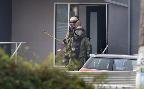 Members of the Winnipeg Police bomb unit leave a law office on River Ave. near Clarke St. after an explosion Friday morning.  Bill Redekop story. Wayne Glowacki / Winnipeg Free Press July 3  2015