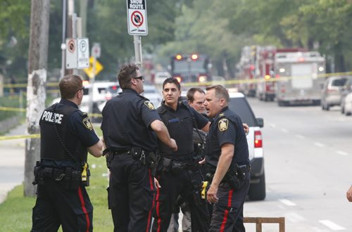 Members of the Winnipeg Police near a law office on River Ave. close to  Clarke St. after an explosion Friday morning.  Bill Redekop story. The street was closed to traffic during the investigation. Wayne Glowacki / Winnipeg Free Press July 3  2015