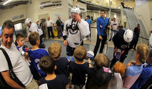 Several Jets prospects signs autographs for the kids after he got off the ice at The Winnipeg Jets 2015 Development Camp at MTS Iceplex. BORIS MINKEVICH/WINNIPEG FREE PRESS July 3, 2015