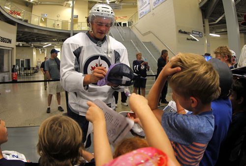 Brendan Lemeiux signs autographs for the kids after he got off the ice at The Winnipeg Jets 2015 Development Camp at MTS Iceplex. BORIS MINKEVICH/WINNIPEG FREE PRESS July 3, 2015