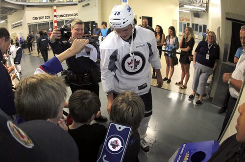 Brendan Lemeiux signs autographs for the kids after he got off the ice at The Winnipeg Jets 2015 Development Camp at MTS Iceplex. BORIS MINKEVICH/WINNIPEG FREE PRESS July 3, 2015