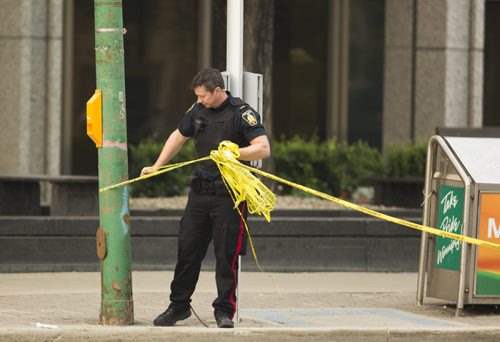 Police re-open the road after investigating at Broadway and Hargrave in Winnipeg on Friday, July 3, 2015. Mikaela MacKenzie / Winnipeg Free Press