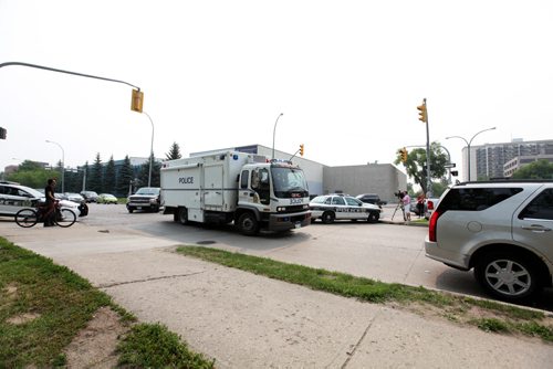 Bomb squad unit makes its way across Donald down River Ave. Friday after a bomb went off in the hands of a worker at 252 River Ave. Streets in area were  blocked off for hours. See story.  July 03,, 2015 Ruth Bonneville / Winnipeg Free Press
