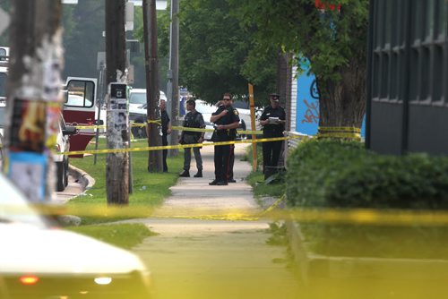 Scene on River Ave. looking east  during investigation of bombing that took place at Petersen and King Law Office at 252 River Ave. Friday morning. A bomb went off in the hands of one of the workers in the office and she was taken to hospital in critical condition.    See story.  July 03,, 2015 Ruth Bonneville / Winnipeg Free Press