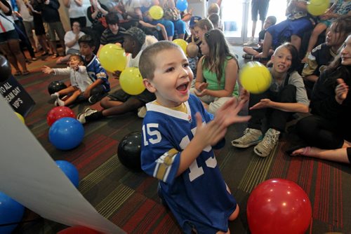 Seven-year-old Matthew Coleshill claps and beams with a wide smile Saturday morning after hearing the news that he won a new bed from Dufresne Furniture while taking part in the IGF Sleepover Friday night.  Coleshill was one of 23 children with the Big Brothers and Big Sisters organization that took part in the sleepover at Investors Group Stadium Friday night that included; meeting some of the Bomber players, games, movies and a sleepover in one of the stadiums suites.  The final gift was that each child got to keep the bed that they slept in courtesy of Dufresne Furniture.  See story.   July 04, 2015 Ruth Bonneville / Winnipeg Free Press