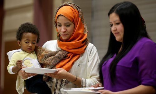 From left, Maria Chaby, her son Ibrahima, 16 mo  and Melissa Brown, at Ramadan: Breaking the Fast Meal at Manitoba Grand Mosque, Saturday, July 4, 2015. (TREVOR HAGAN/WINNIPEG FREE PRESS)  for faith column