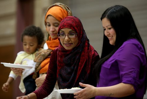 From left, Maria Chaby, her son Ibrahima, 16 mo, Natasha Ali, and Melissa Brown, at Ramadan: Breaking the Fast Meal at Manitoba Grand Mosque, Saturday, July 4, 2015. (TREVOR HAGAN/WINNIPEG FREE PRESS)  for faith column