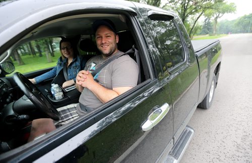 Brandi and Andrew Cristo, from Thompson, didn't know about the restrictions. Traffic on Wellington Crescent, which is supposed to be limited to only one block, Sunday, July 5, 2015. (TREVOR HAGAN/WINNIPEG FREE PRESS)