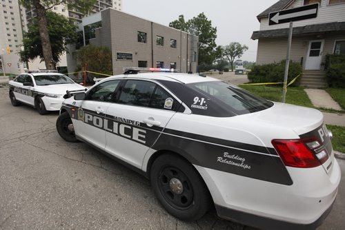 July 5, 2015 - 150705  -  Police investigate at a law office on River Avenue Sunday, July 5, 2015. John Woods / Winnipeg Free Press