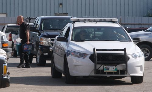 Police are still on scene at a small autobody shop on Washington Ave Monday morning- On Saturday police swarmed the autobody shop  and later detonated a package inside the Washington business by a bomb unit robot using a water cannon-Breaking News- July 06, 2015   (JOE BRYKSA / WINNIPEG FREE PRESS)