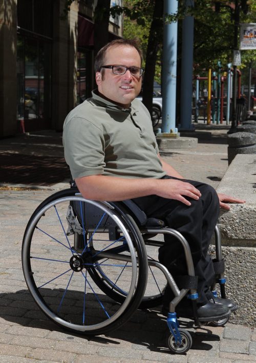 Allen Mankewich is in a wheelchair since birth and is the subject in Jen Zoratti story about accessibility for concerts and festivals. BORIS MINKEVICH/WINNIPEG FREE PRESS July 6, 2015