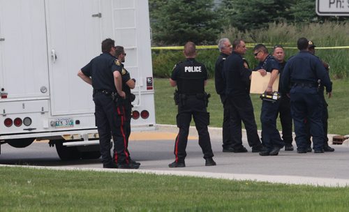 Winnipeg Fire and Police and RCMP bomb squad clear  Canada Post mail sorting facility at 1870 Wellington Ave after was suspicious package was deemed clear of any dangers- RCMP  Bomb squad emerges with x-ray from inside facility-See story- July 06, 2015   (JOE BRYKSA / WINNIPEG FREE PRESS)