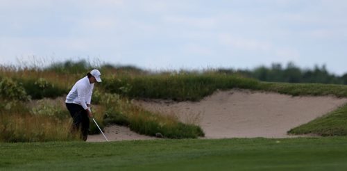 Aaron Cockerill in a bunker on 18 while he tries to qualify for the Players Cup, during a qualifying round at Southwood, Monday, July 6, 2015. (TREVOR HAGAN/WINNIPEG FREE PRESS)