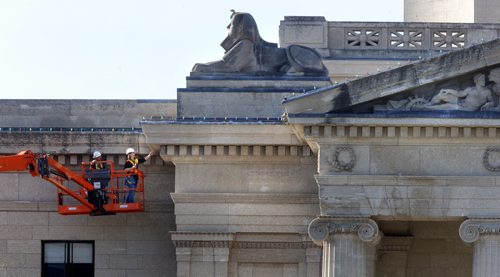 On Tuesday morning, Carrie Hunter, with Taylor Hazell Architects Ltd. with lift operator Chris Stove continues the inspection of the exterior of the Manitoba Legislative Building. She is part of a team to determine how to restore the building to what it looked liked on July 15, 1920 when it opened to the public. The detailed examination of the tyndall stone exterior is being made so a  decision can be made about how to properly restore it for the building's centennial in 2020. Wayne Glowacki / Winnipeg Free Press July 7  2015
