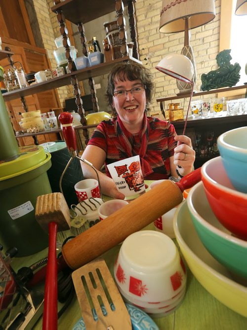 Lisa Boland shows off some of the vintage kitchenware and collectibles at her stall at Old House Revival on Young Street on Mon., July 6, 2015. Boland, whose shop is called Bitchin' Kitsch 'n' Kitchen, will be part of a pop-up market on Sherbrook Street next week. RE: Sanderson Intersection story Photo by Jason Halstead/Winnipeg Free Press