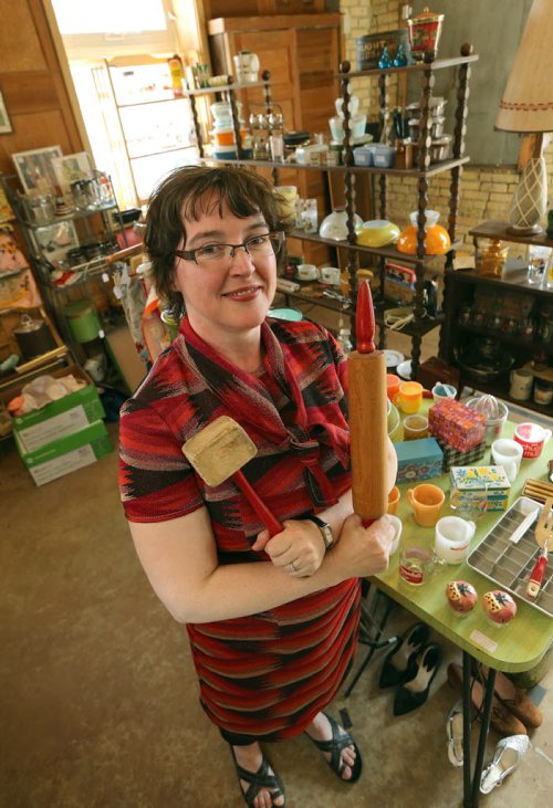 Lisa Boland shows off some of the vintage kitchenware and collectibles at her stall at Old House Revival on Young Street on Mon., July 6, 2015. Boland, whose shop is called Bitchin' Kitsch 'n' Kitchen, will be part of a pop-up market on Sherbrook Street next week. RE: Sanderson Intersection story Photo by Jason Halstead/Winnipeg Free Press
