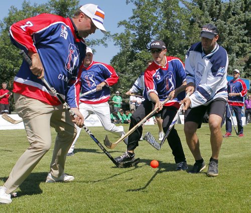 Josh Green in white represents the NHL hockey players in the friendly match against some of the golfers in the Players Cup at Pine Ridge Golf Course. The players won after a lengthy shoot out. BORIS MINKEVICH/WINNIPEG FREE PRESS July 7, 2015