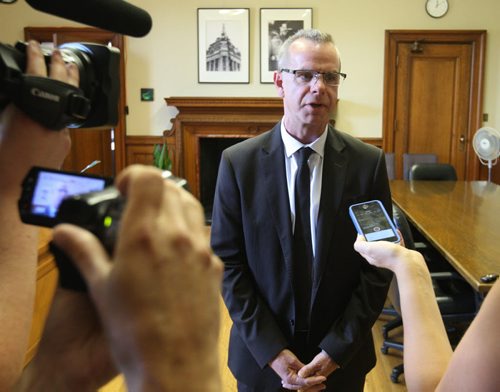 Education and Advanced Learning Minister James Allum speaks to reporters in his office Tuesday regarding the  Manitoba Government releasing a review into Winnipeg School Division.   Wayne Glowacki / Winnipeg Free Press July 7  2015