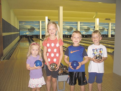 Canstar Community News Julia, Annika, Caleb and Lincoln enjoy a couple games at Rossmere Lanes. As part of Bowl Manitoba's Kids Bowl Free program, parents can register their kids to receive two free games a day, Monday to Friday, all summer long.
