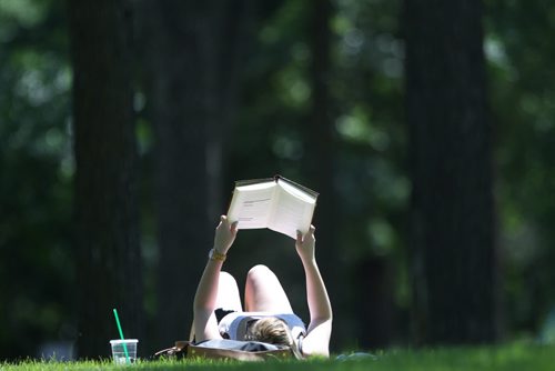 Ashley Daily enjoys a book in the sunshine at Kildonan Park Tuesday afternoon Standup Photo- July 07, 2015   (JOE BRYKSA / WINNIPEG FREE PRESS)
