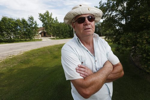 July 7, 2015 - 150707  -  David Kane, neighbour of Iris Amsel, ex-wife of Guido Ansel, is photographed outside Iris Amsel's house Tuesday, July 7, 2015. John Woods / Winnipeg Free Press
