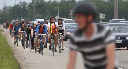 About 250 cyclists travelling along on Hwy. 59  were among the many heading to Birds Hill Provincial Park early Wednesday morning as the Festival Campground opens Wednesday for the 2015 Winnipeg Folk Festival that begins Thursday. The earlier you arrive the better the campsite you can acquire, any area near trees are in highest demand. Wayne Glowacki / Winnipeg Free Press July 8  2015