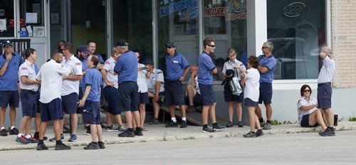 Evacuated Canada Post workers wait down the street from the Canada Post building on Nairn Ave near Panet Rd. Wednesday morning after suspicious mail was found. Bill Redekop story Wayne Glowacki / Winnipeg Free Press July 8  2015