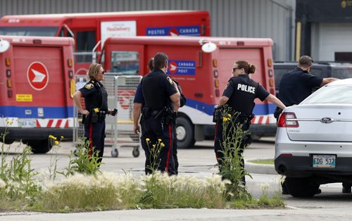 Winnipeg Police at the Canada Post building on Nairn Ave. near Panet Rd. Wednesday morning after a report of suspicious mail found. The building was evacuated. Bill Redekop story Wayne Glowacki / Winnipeg Free Press July 8  2015