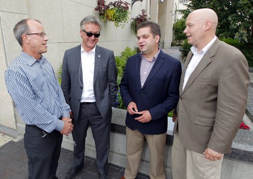 Five councillors are rallying against the citys cycling strategy and took out a radio ad today that will run until council votes on the strategy next Wednesday. Four of those councillors: Shawn Dobson, Ross Eadie, Jeff Browaty, and Jason Schreyer pose for a photo. BORIS MINKEVICH/WINNIPEG FREE PRESS July 8, 2015