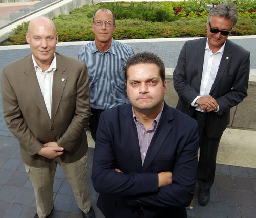 Five councillors are rallying against the citys cycling strategy and took out a radio ad today that will run until council votes on the strategy next Wednesday. Four of those councillors: Jason Schreyer, Shawn Dobson, and Ross Eadie stand behind Jeff Browaty(centre) in this photo. BORIS MINKEVICH/WINNIPEG FREE PRESS July 8, 2015