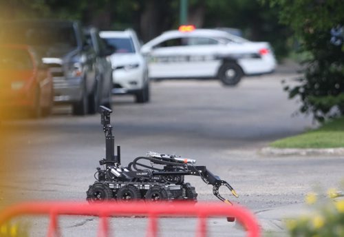 Winnipeg Police used their bomb unit robot to shoot a water canon at a suspicious package found at St Annes and Bank Ave-Breaking News- July 08, 2015   (JOE BRYKSA / WINNIPEG FREE PRESS)