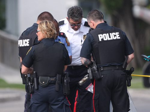 Winnipeg Police used their bob unit robot to shoot a water canon at a suspicious package found at St Annes and Bank Ave- They investigate item once it was deemed safe-Breaking News- July 08, 2015   (JOE BRYKSA / WINNIPEG FREE PRESS)